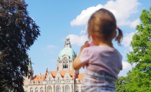 Rear view of girl looking at church