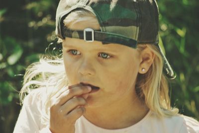 Close-up of girl looking away outdoors