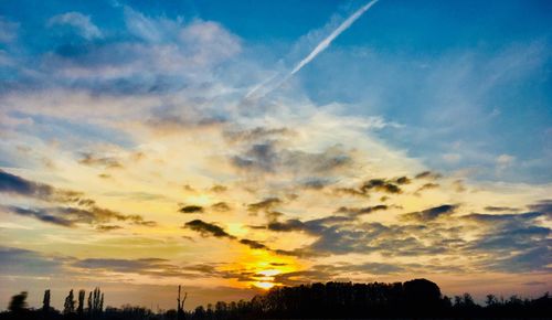 Low angle view of vapor trails in sky