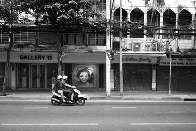 Man riding motorcycle on road