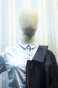 Suit in mannequin at store for sale