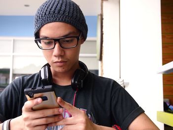 Teenager using mobile phone