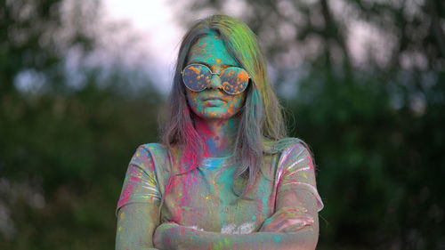 Portrait of woman with multi colored face