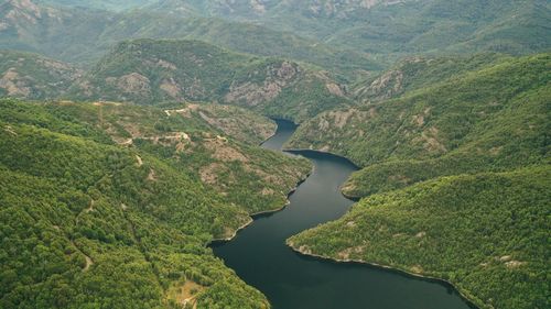 High angle view of river amidst mountains