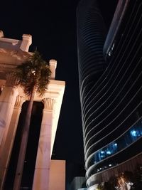 Low angle view of illuminated building at night