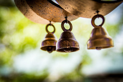 Low angle view of metal wind chimes 