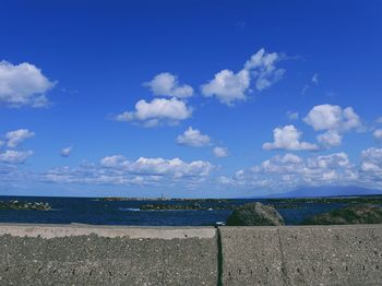 Scenic view of sea against blue sky