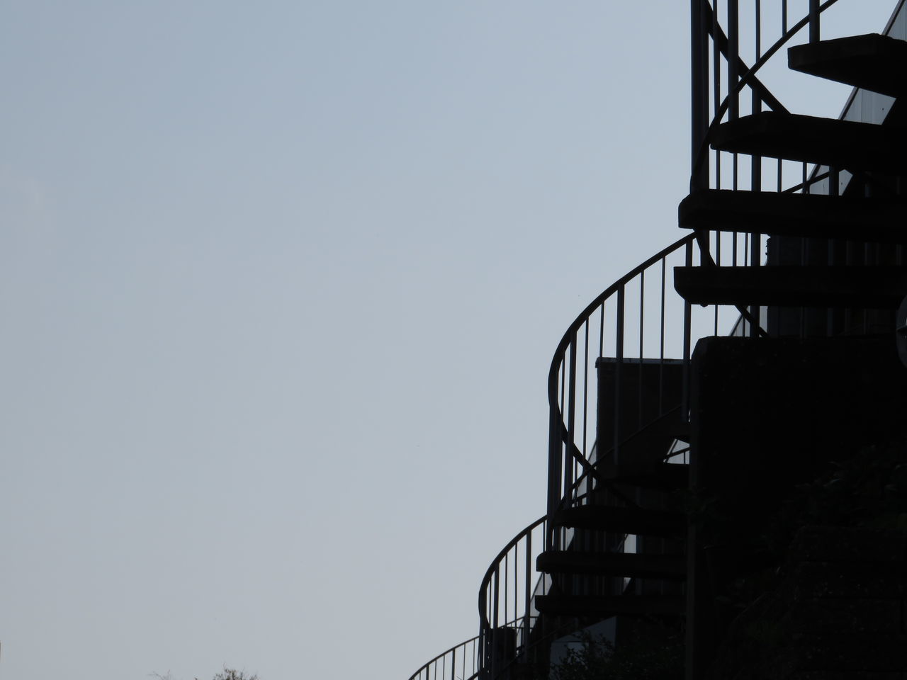 LOW ANGLE VIEW OF SILHOUETTE STAIRCASE AGAINST BUILDING