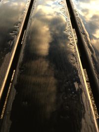 High angle view of railroad tracks against cloudy sky