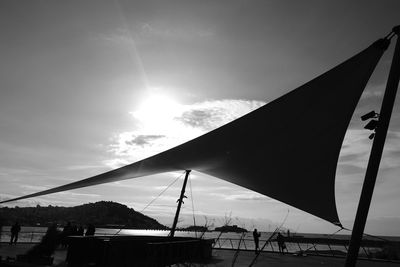 Low angle view of suspension bridge against sky