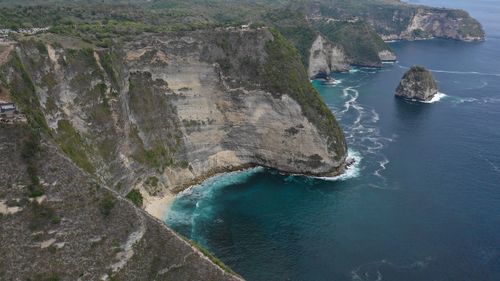 High angle view of rocks on sea