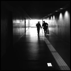 Silhouette of woman in corridor