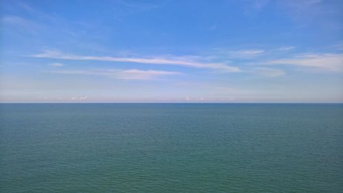 Scenic view of sea against blue sky