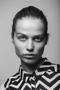 Fashion portrait of a young woman in black and white