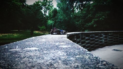 Surface level of people sitting on rock