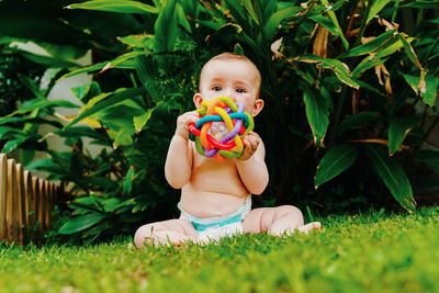 Full length of cute baby girl on field