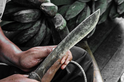 Close-up of man working on wood