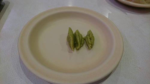 High angle view of vegetables in plate on table