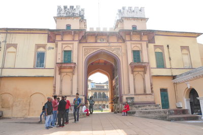 Group of people in front of historical building