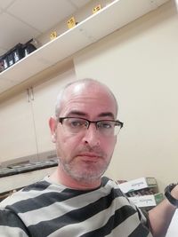 Portrait of man wearing eyeglasses