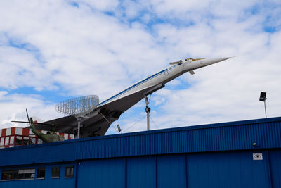 Low angle view of airplane against sky