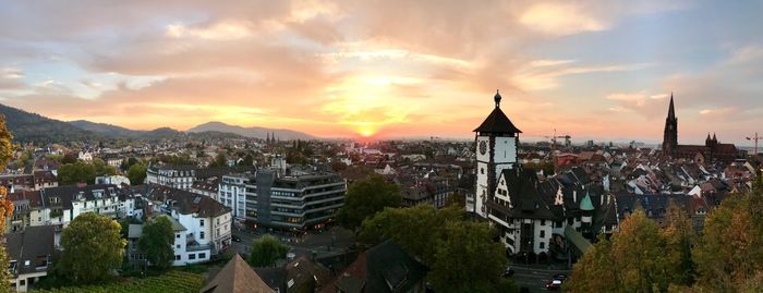 High angle view of buildings against sky during sunset