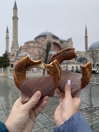 Cropped hand of person holding simit in istanbul