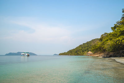 Ferry boat in sea against sky