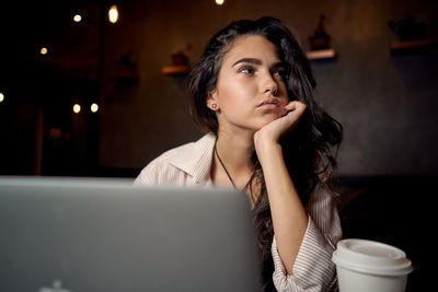 Young woman looking at camera