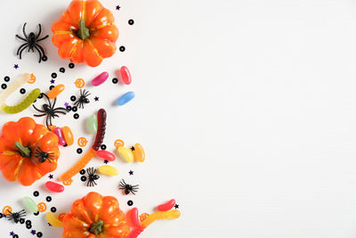 Close-up of fruits on table against white background