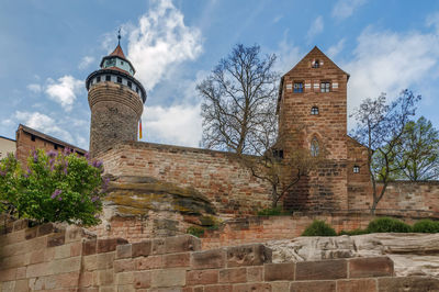 Low angle view of historic building against sky