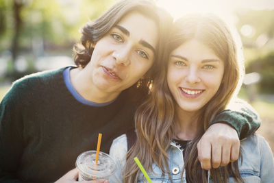 Portrait of happy teenagers at park