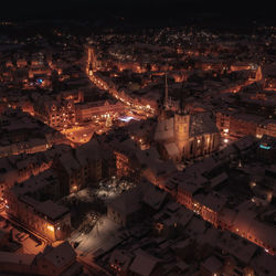 High angle view of illuminated buildings in city at night