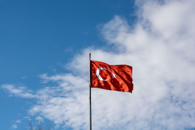 Low angle view of flag against sky