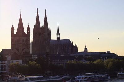View of river in city against sky