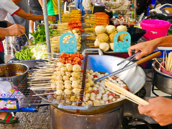 People having food at market stall