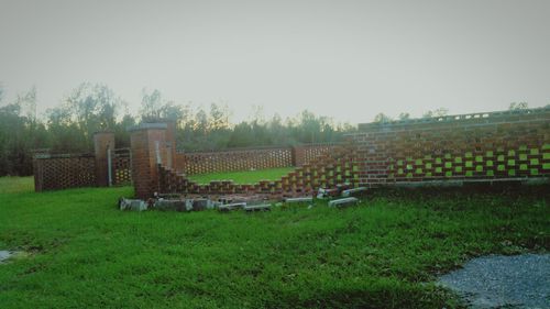 Built structure on farm against sky