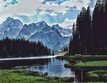 Scenic view of lake and mountains against sky