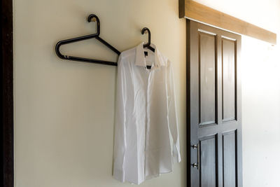 Close-up of piano hanging in bathroom