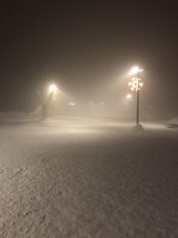 Street light on snow covered land