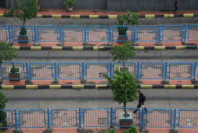 High angle view of building by railing in city