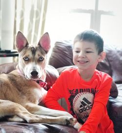 Portrait of cute boy with dog