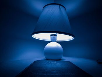 Close-up of electric lamp at home