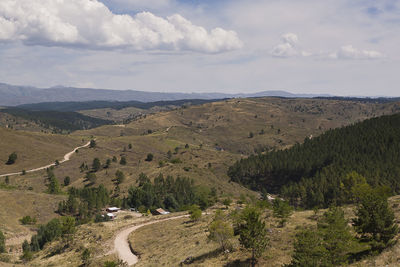 Scenic view of landscape against cloudy sky