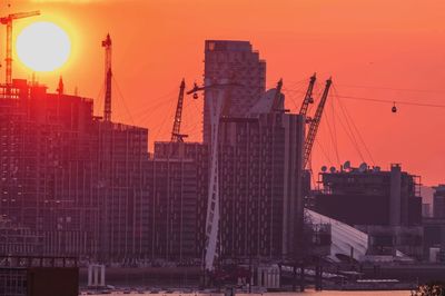 Buildings against sky during sunset