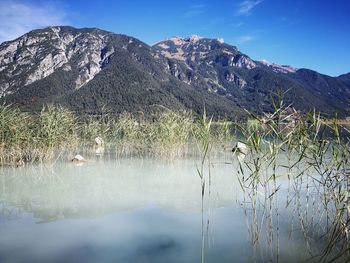 Scenic view of lake against mountain range