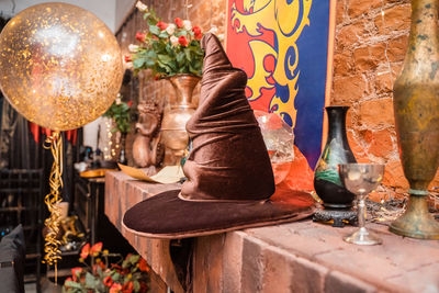 Sorting hat and magic items from the harry potter book. interior design in the style of hogwarts