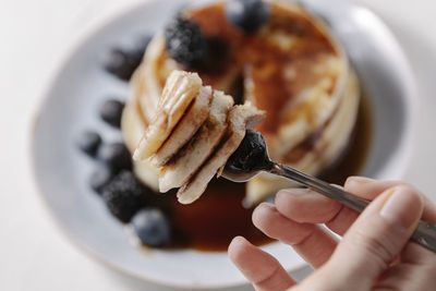 Pancakes with blueberry on a fork