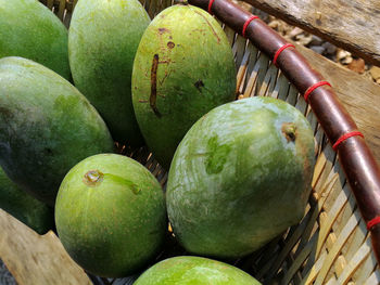 High angle view of fruits in basket on table