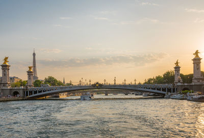 Pont alexandre iii bridge over river against sky